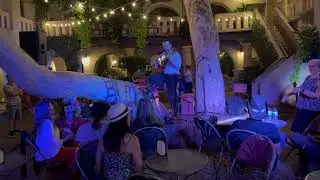 After the performance, David Merino closes the night with unplugged Greek music.