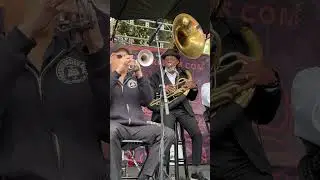 Preservation Brass Band playing in Jackson Square for the 2024 French Quarter Festival New Orleans