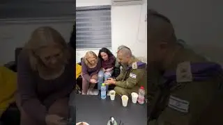 Mothers of the three released hostages watch them return into Israel territory