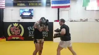 Coach Aaron Meisner hitting pads with Ian Anderson Muay thai Rnd 3 03/08/2019