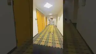 Man struts down office hallway with drink#officefun #hallwaystrut #confidentwalk