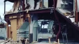 Two story building falling gif