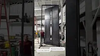 Oversized 15 ft residential security door made of steel for a luxury home in La Jolla CA #pivotdoor