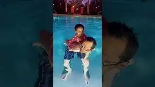 Braving the waters, baby&rsquo;s first swim with daddy&rsquo;s help