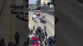 Police fired rubber bullets and flashbangs after pro-immigrant protesters halt Los Angeles traffic.
