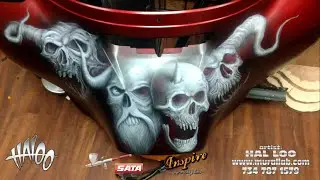 Freehand skulls on a Harley fairing