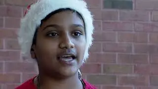 Scofield Magnet Middle School student elves fill boxes for homeless shelter