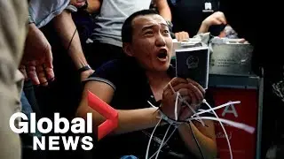 Hong Kong airport chaos: Protesters tie up, interrogate man accused of being undercover police