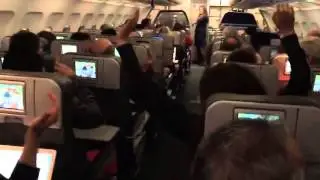 Plane Full of Patriots Fans Watching Game On TVs React To Team's Win