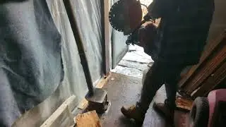 cutting a sea can with a gas axe