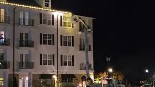 Commercial professional Christmas light installation with bucket truck in Virginia