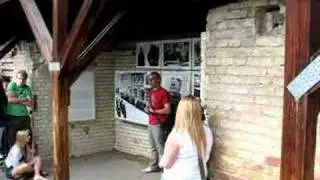 Guide explaining SS HQ by Berlin Wall