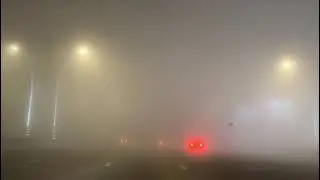 Driving through dense fog at 3am on Sheikh Zayed Road, Dubai, UAE. Date 13th February 2021.
