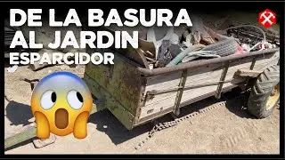 Esparcidor de estiércol habilitado para un jardín