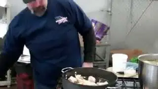 MAN WITH A PAN MAKES PAELLA