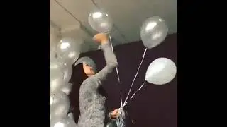 Beautiful Girl Stabbing Balloons After the Event / Looner Squad