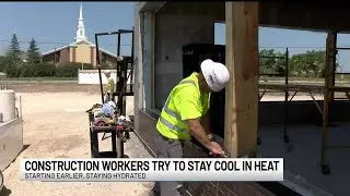 Construction workers try to stay cool in heat
