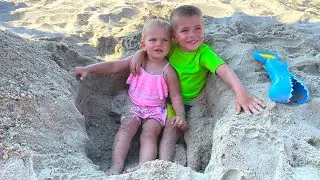 Mike and Emy are playing on the beach