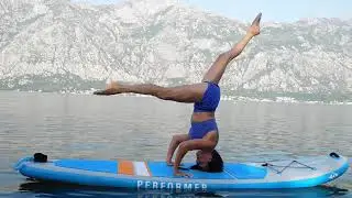 SUP-Yoga.Sirsasana on Sup-board. Headstand on Sup-board.Yoga coach Zhanna Potapova 2019.