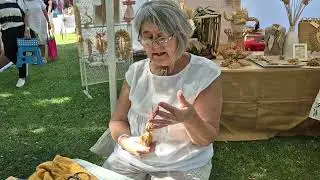 Making a corn dolly for nutmeg, Lost Trades Fair, Bendigo, Victoria, Australia