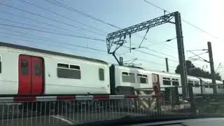 A class 321 and class 66 at Manningtree level crossing