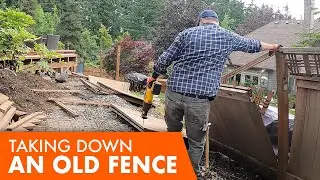 Rotten trash fence had to go. Demolishing a fence  and digging a retaining wall base
