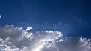 8K Stock Video - Time lapse of clouds moving as sun rays shine through