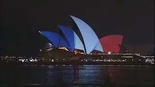 World landmarks light up for Paris