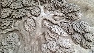 Amazed as he makes cement tree float on wall