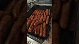 Devilled sausage and mashed potatoes, carrots, peas