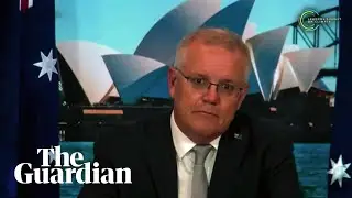 Australian prime minister Scott Morrison grapples with mute microphone at climate summit