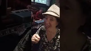 The 85 year old June singing  in a Glasgow pub on a Tuesday afternoon.