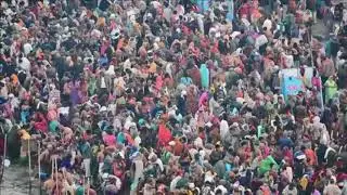 Hindu pilgrims take a holy bath in the Ganges