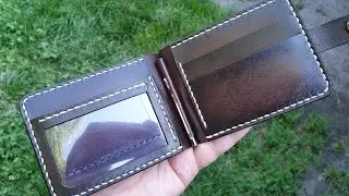Handmade wallet with a transparent pocket. Vegetable tanned leather. Hand stitched.