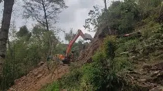 JCB Excavator: Building Vital Roads for Hilly Villagers!