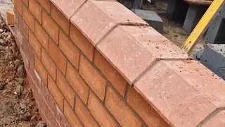 Building brickwork with corbel detail.