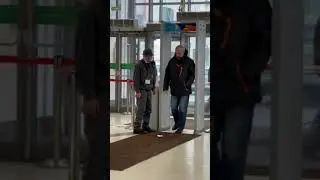 Security guard is falling asleep standing up at the door!