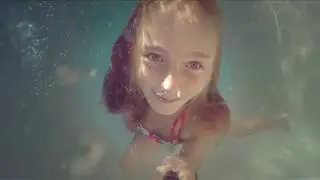 Carla Underwater - swimming underwater and blowing bubbles