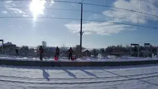 View of the snowy countryside from the train window