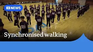 How synchronised walking became a smash hit in Japan | ABC NEWS