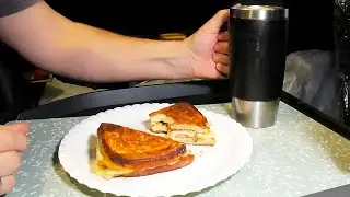 Truck driver cooking inside truck. Morning sandwich before work routine!