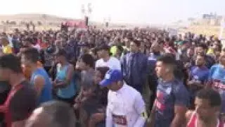 Thousands run a marathon through Egypt's pyramids