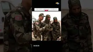 EOD (Explosive Ordnance Disposal) machine picks up grenade