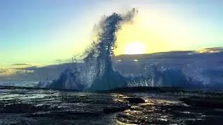 Slow mo wave action at sunrise