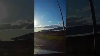 Dash Cam of Green Energy Wind Turbine Blades being transported by Train 🚂 in the distance at Sunset