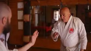 Inside or outside body positioning as self defence in an aggressive confrontation .