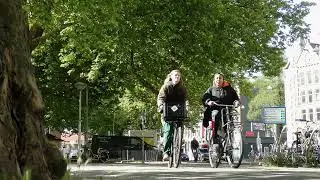bikes, cars, and buses on Nassaukade in Amsterdam in 4k