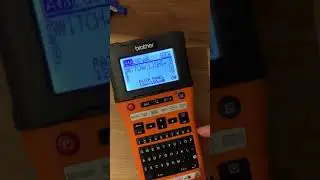 Electrician labelling a consumer unit using the Brother EW550 P-Touch printer without the APP