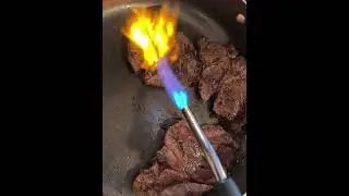 Searing steaks with torch