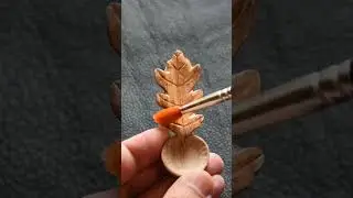 Oiling an oak leaf spoon, carved in cherry.